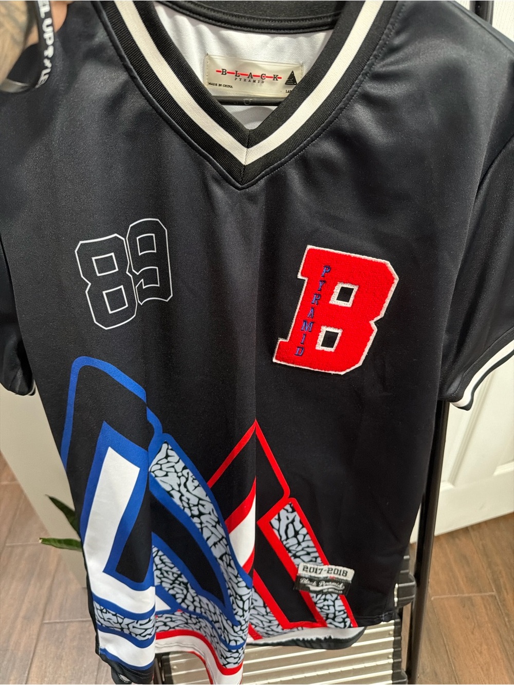 Black Pyramid Black Jersey with Red 'B' and Blue Graphic Accents